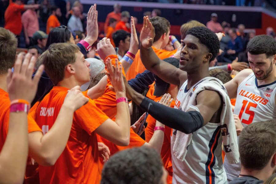 Senior Guard Da’Monte Williams and Junior Forward Giorgi Bezhanishvili interact with students and fans before their match against Iowa on March 8.