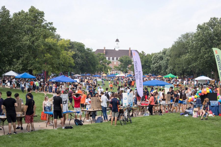 Students+and+representatives+for+Registered+Student+Organizations+mingle+on+Quad+Day+on+Aug.+26%2C+2019.