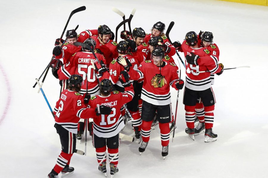 The+Chicago+Blackhawks+celebrate+a+3-2+victory+against+the+Edmonton+Oilers+to+win+Game+4+and+clinch+the+Western+Conference+Qualification+Round+series+at+Rogers+Place+in+Edmonton%2C+Alberta%2C+on+Aug.+7.+After+the+cancellation+of+sports+in+March%2C+the+NHL+season+restarted+and+is+now+nearing+the+quarterfinals.