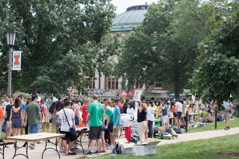 Tables line the edges of walkways on the quad as students inquire about the many RSOs being represented during Quad Day on Aug. 26, 2018.