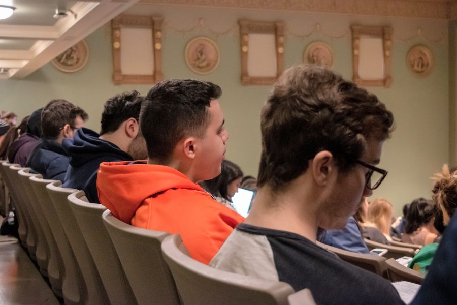 Students enrolled in a Statistics class listen attentively during a lecture at Lincoln Hall Theater on Dec. 3, 2019.
