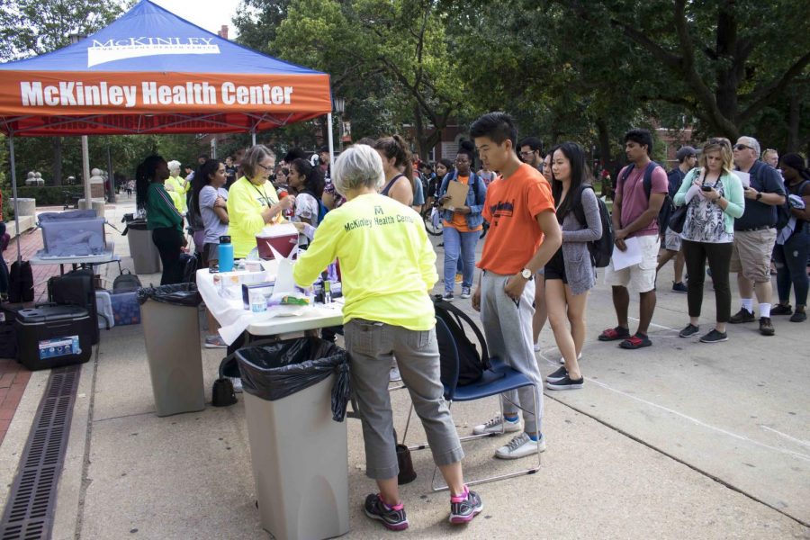Students line up on the Main Quad to get flu shots at McKinley Health Center’s Flu Shot Clinic on Oct. 1, 2018. Health officials encourage flu shots to avoid overwhelming hospitals this winter.