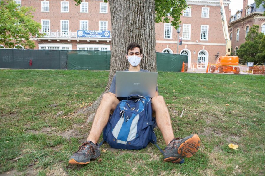 Junior Tony Glatz sits underneath a tree on the Main Quad on Wednesday morning. Overall, testing efficiency has improved — with most results being updated within 24 hours, the rate of inconclusive tests has remained stagnant and the rate of invalid tests has dropped from 5% to 0.67% from July to mid-September.