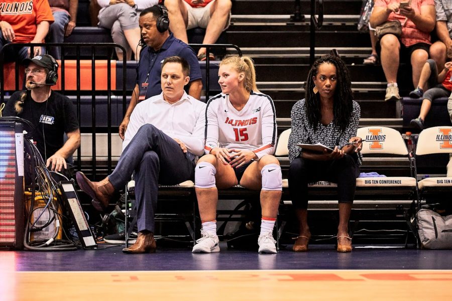 Head+volleyball+coach+Chris+Tamas+speaks+with+current+senior+Megan+Cooney+during+the+game+against+Tennessee+on+Sept.+1%2C+2019.
