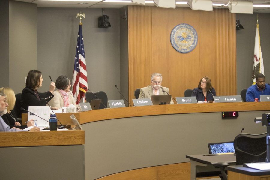The Champaign City Council members discuss and vote on proposed bills on April 18, 2018.