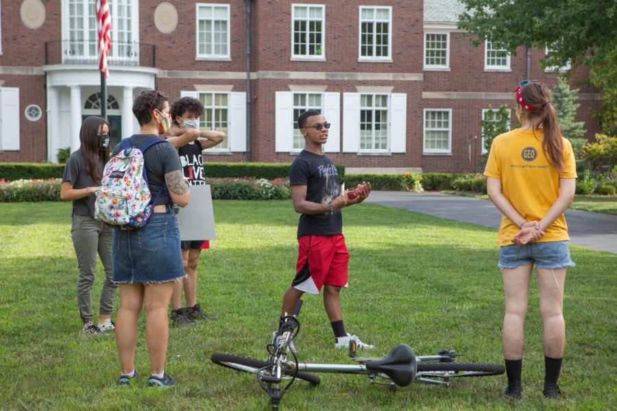 University graduate Drake Materre speaks to demonstrators outside of UI President Tim Killeen's house during a similar protest on Aug. 29.