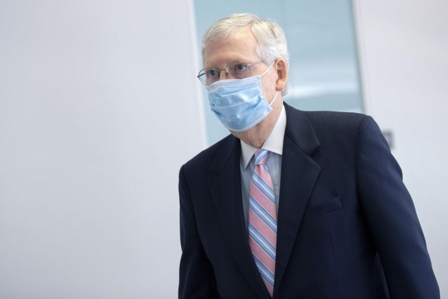 Senate Majority Leader Mitch McConnell walks through the Hart Senate Office Building on Capitol Hill on Aug. 6 in Washington, DC.