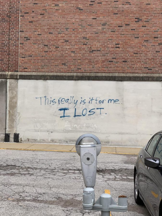 Concerning graffiti lays painted on the side of the Main Library on Oct. 24. Some students have felt the negative effects of COVID-19 on their mental health.