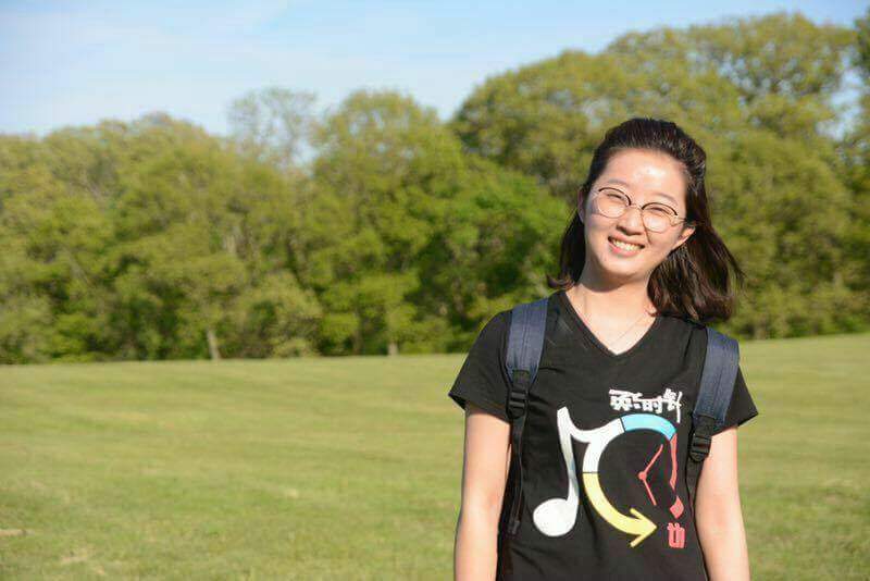 Yingying Zhang stands in an open field. Zhang was reported missing in 2017.