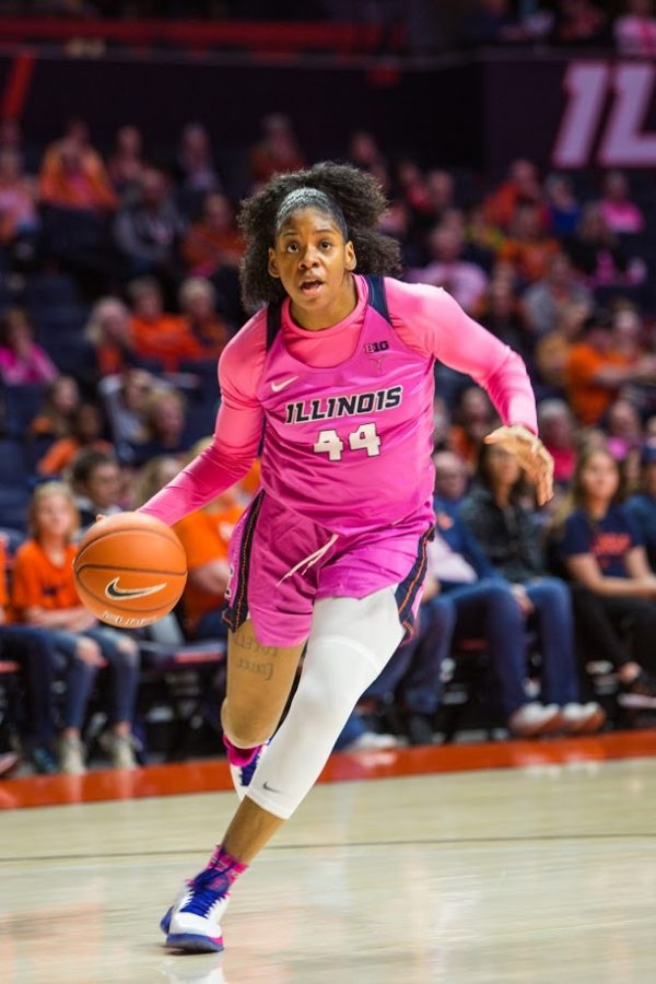 Sophomore forward Kennedi Myles advances the ball down the court during the game against Wisconsin on Sunday. The Illini lost the game 73-64.