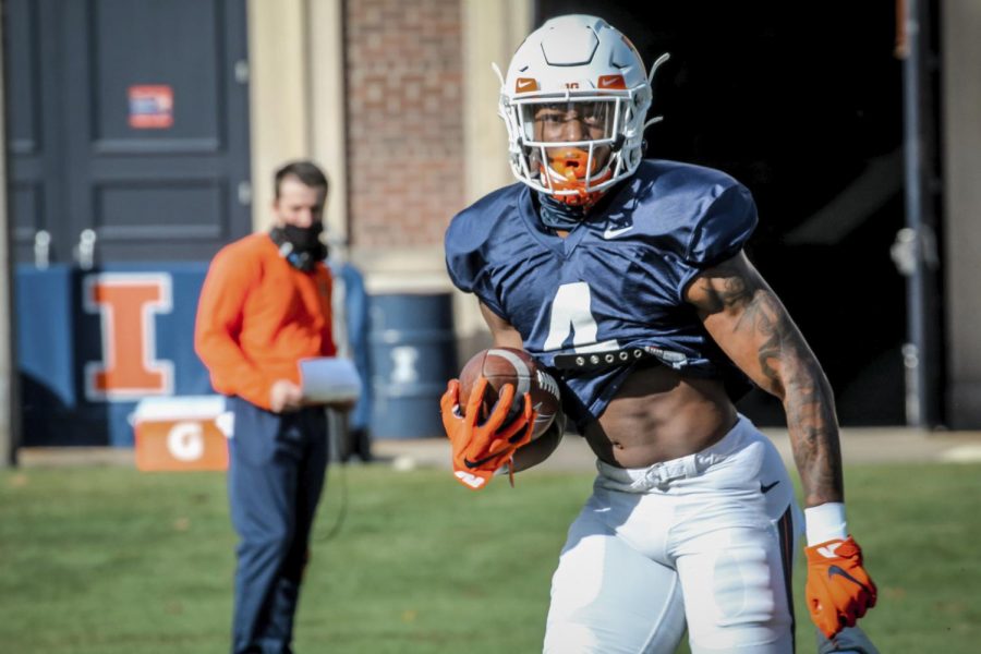 Sophomore wide receiver Khmari Thompson stands ready with the ball at football practice on Thursday. Thompson adds speed and strength to the team after transferring from Missouri, measuring in at 6-foot-1-inch and 220 pounds.