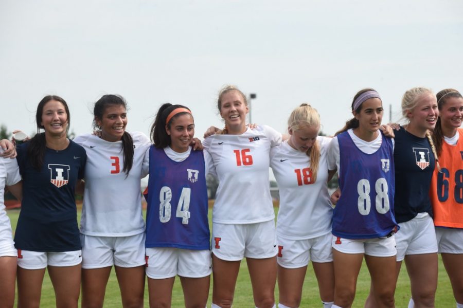 The Illinois soccer team stands together in a line during the opening of the Demirjian Park on Sept. 15, 2019. The team’s usual fall season was postponed to spring 2021.