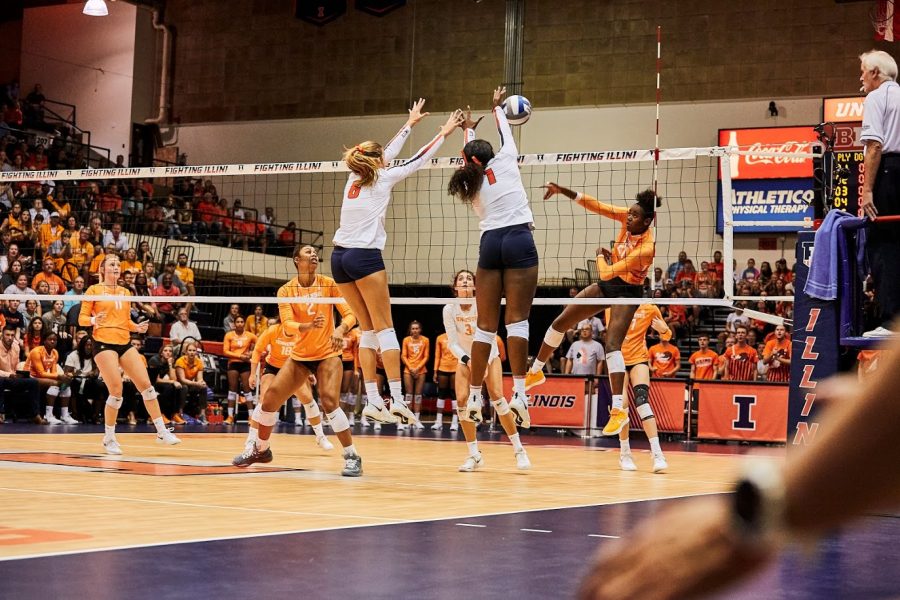 Sophomores Kyla Swanson and Kennedy Collins block a spike during the match against Tennessee on Sept. 1, 2019. Collins and two of her teammates stayed in touch last semester to workout over zoom.