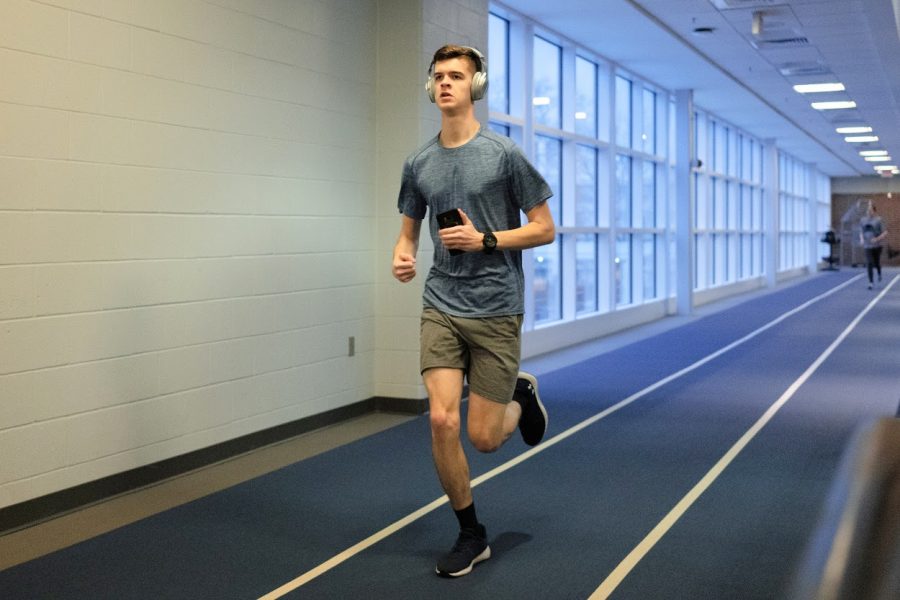 A student runs around the indoor track at the ARC on Feb. 29. Columnist Chiara discusses the negatives of wearing a mask while working out.