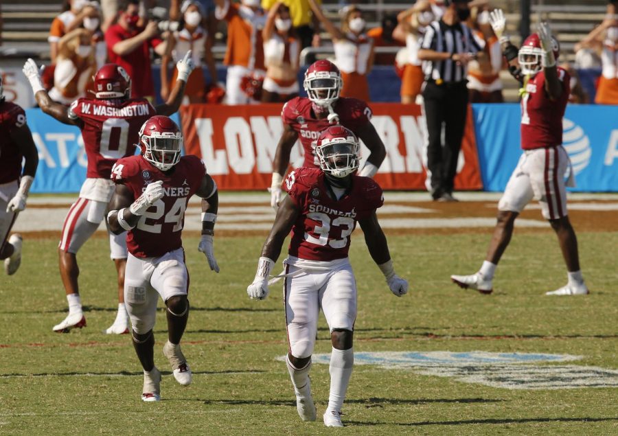 Oklahoma+defensive+lineman+Marcus+Stripling+%2833%29+and+linebacker+Brian+Asamoah+%2824%29+celebrate+a+missed+Texas+field+goal+in+triple+overtime+at+the+Cotton+Bowl+in+Dallas+on+Saturday.+Oklahoma+won+in+quadruple+overtime%2C+53-45.+