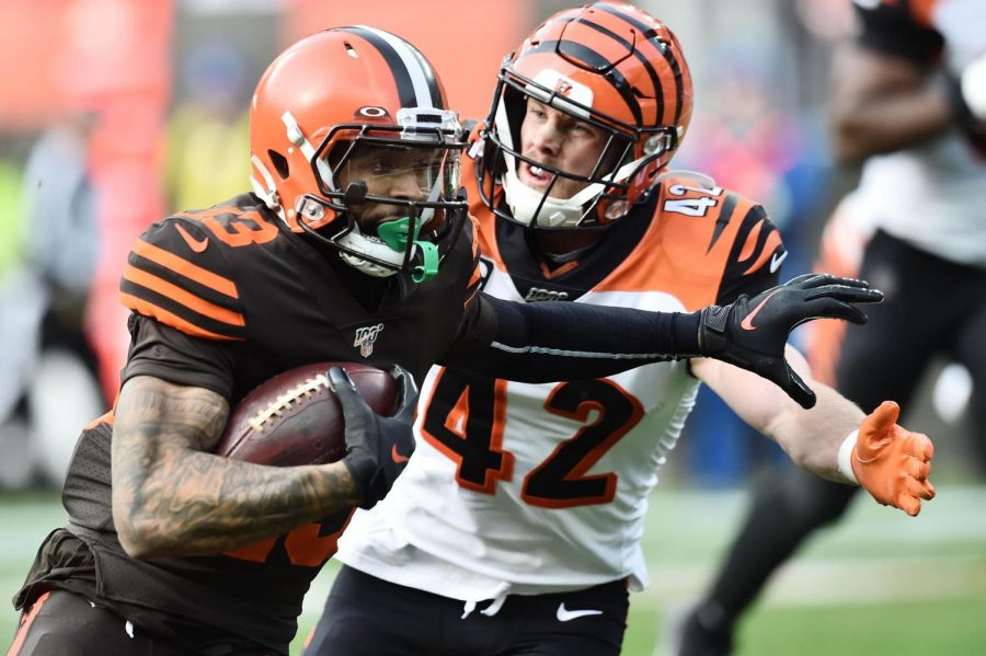 Cincinnati Bengals safety Clayton Fejedelem chases Cleveland Browns receiver Odell Beckham during their game on March 15. The Browns won 37-34.