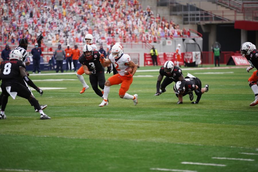 Running back Chase Brown advances the ball during the game against Nebraska on Saturday.