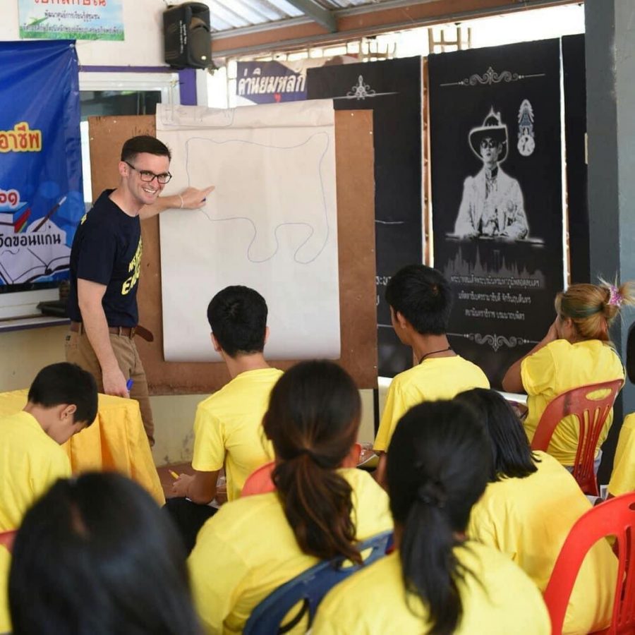 Nick Melrose teaches an adult English education class in Thailand. Melrose and other University of Illinois alumni discuss the life-changing experiences the Peace Corps awarded them.