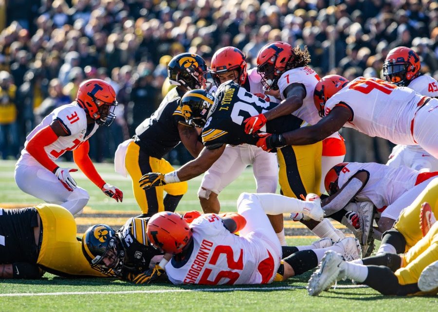 Illinois tries to tackle an Iowa player during the game against Iowa on Nov. 23. Sophomore defensive back Devon Witherspoon has been a key contributor for the Illini so far this season, accumulating 15 tackles in two games in 2020. 