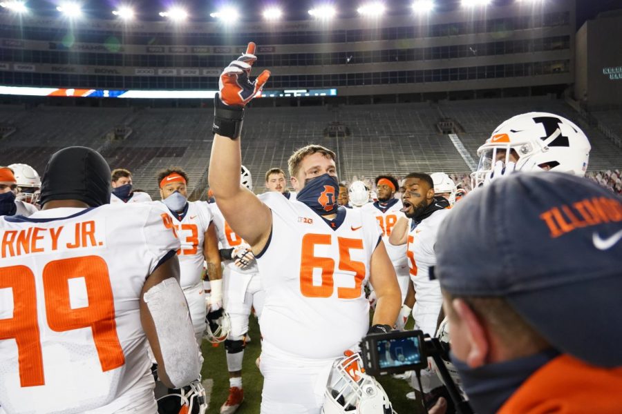 Illinois+team+members+stand+in+Camp+Randall+stadium+while+wearing+masks+before+the+game+against+Wisconsin+on+Oct.+23.+The+Illini+fell+45-7+in+the+season+opener.
