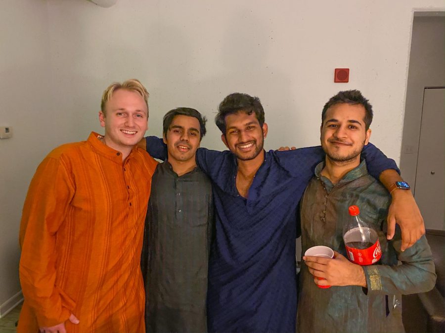 Sean Norris, Siddharth Salklan, Sathwik Reddy and Shivam Sehgal pose for a photo during Diwali on Saturday. Diwali celebrants had to adapt this year due to the COVID-19 pandemic.