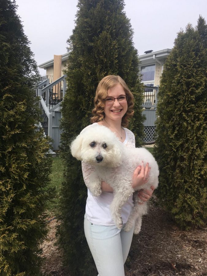 Columnist Ellen Barczak poses with her dog Buddy. Barczak believes people should carefully consider before adopting dogs during the pandemic.