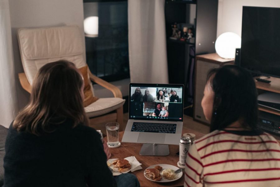A couple celebrates Thanksgiving with friends by having dinner together over a Zoom video call on November 22, 2020 in New York City.