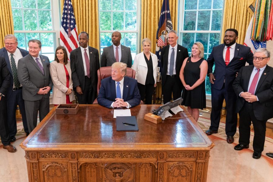 President Donald Trump signs an Executive Order on establishing a White House Council on eliminating regulatory barriers to affordable housing on June 25, 2019, 