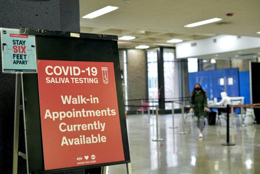 A student exits a COVID-19 testing center on the second floor of the Student Center East at UIC.