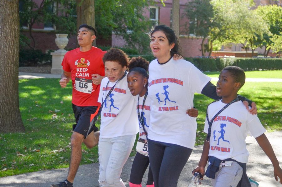 Community members participate in the annual IMP 5k Run and Fun Walk at a time the COVID-19 virus had not reached the United States. The program has had to adapt to the COVID-19 pandemic.