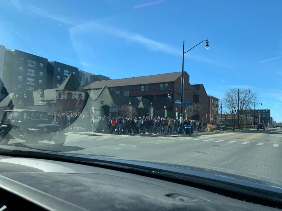 Students stand in line while waiting to enter TheRed Lion on Saturday afternoon. The University has recently instated new guidelines asking students to participate in a soft lockdown.