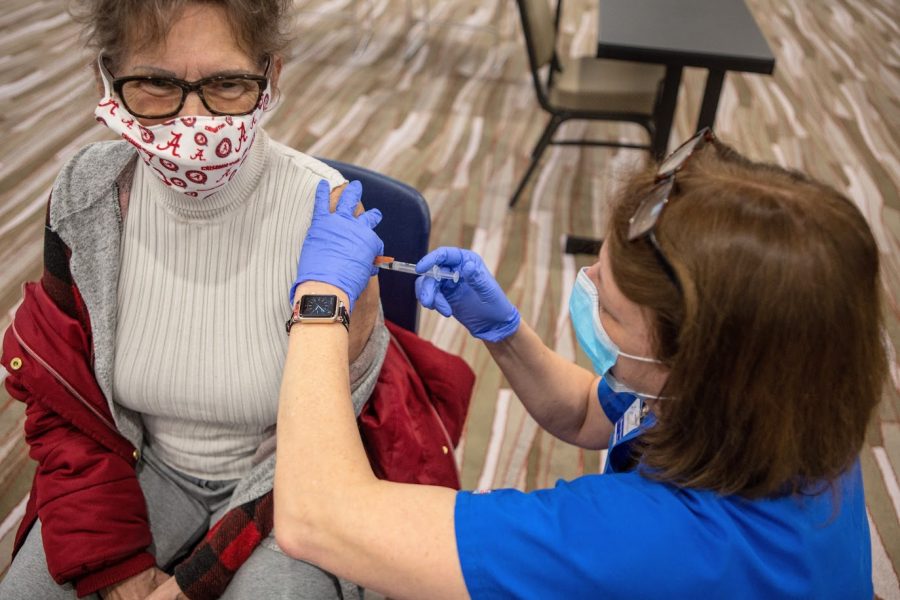 A Champaign County resident receives the Moderna COVID-19 vaccine at the I-Hotel on Jan. 12. Select members of the University community are now eligible for the COVID-19 vaccine.