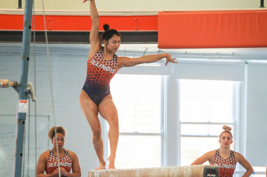 Sophomore+Mia+Takekawa+practices+her+balance+beam+routine+during+practice+on+Dec.+9.+The+Illinois+womens+gymnastics+teams+will+begin+competing+on+Jan.+15.+