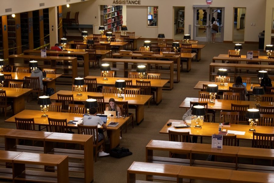 Students+study+in+the+College+of+Law+Library+on+Sept.+20%2C+2019.+Many+libraries+on+campus+have+limited+their+in-person+services+since+the+beginning+of+the+COVID-19+pandemic.