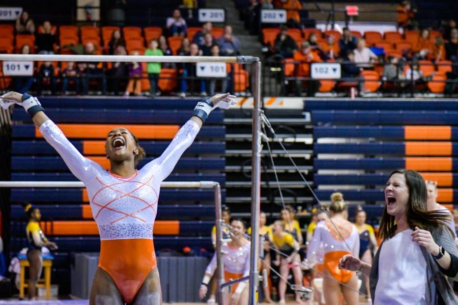 Sophomore+Mia+Townes+celebrates+after+completing+a+routine+during+competition.+The+Illinois+womens+gymnastics+team+will+host+their+first+home+meet+tomorrow+at+Huff+Hall+against+Iowa.