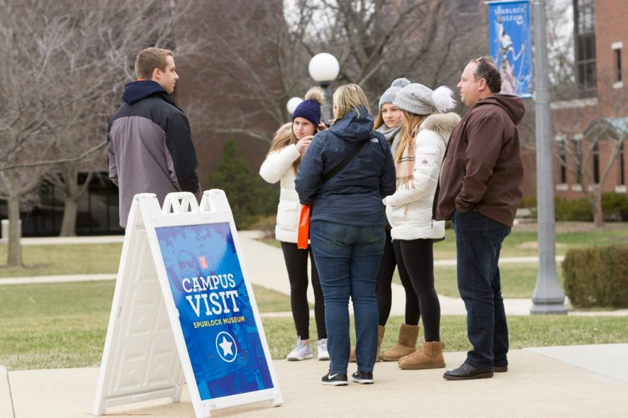 Prospective students and their parents take a tour of campus on March 6, 2018. The COVID-19 pandemic has altered the admissions process at the University.