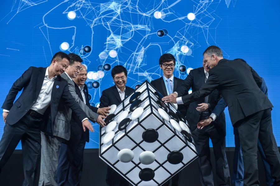 Chinese Go player Ke Jie, third from right, and other guests attend the opening ceremony of the Future of Go Summit before a match between him and Google’s artificial intelligence program AlphaGo in China on May 23, 2017. Columnist Clint argues we must be careful when developing artificial intelligence.