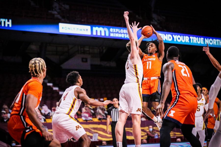 Junior+Ayo+Dosunmu+shoots+the+ball+in+the+first+half+against+Minnesota+on+Feb.+20.+Dosunmu+notched+his+second+triple-double+of+the+season+in+the+94-63+win.