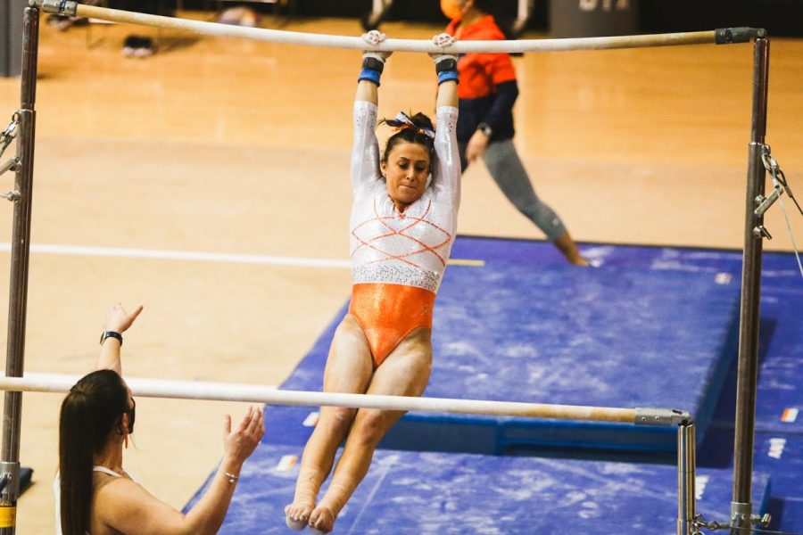 Senior Nicole Biondi performs her uneven bars routine during the meet against Iowa on Jan. 31.