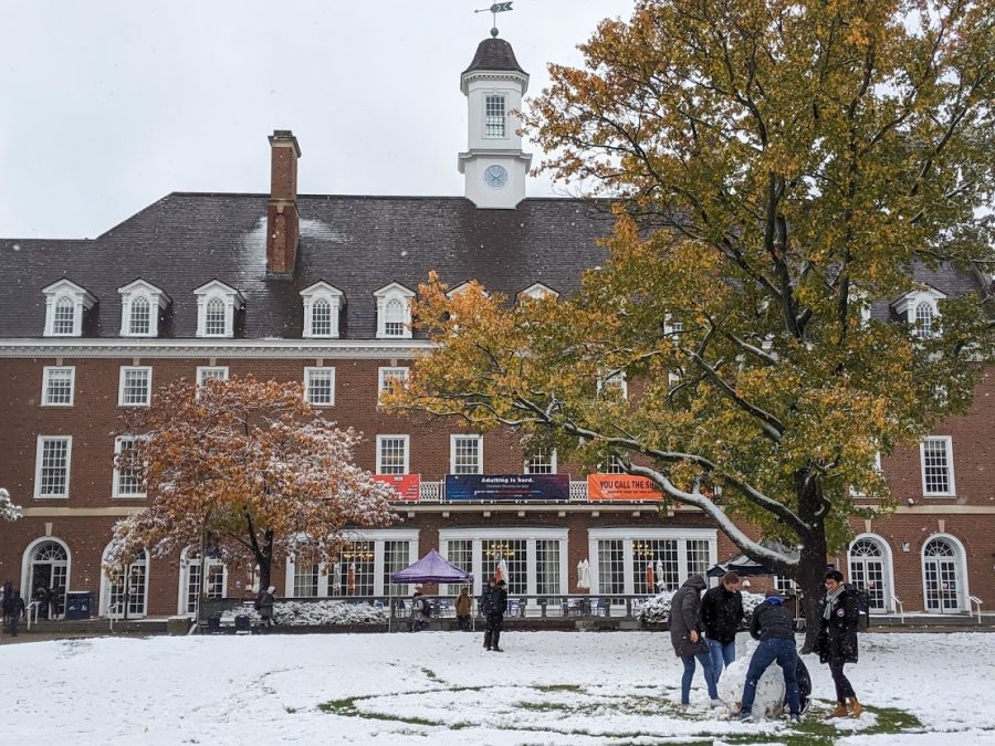 Students have fun in the snow on Oct. 31, 2019. A recent snow storm has caused cancelations in the CU area.