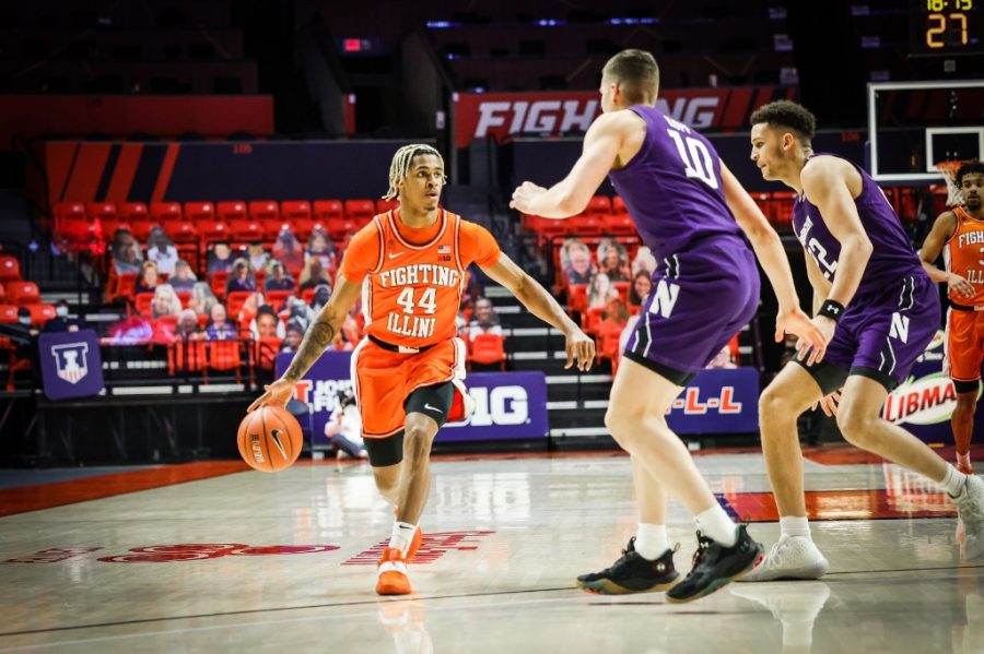 Freshman Adam Miller pushes forward during the game against Northwestern on Tuesday. Illinois prevailed over Northwestern 73-66.