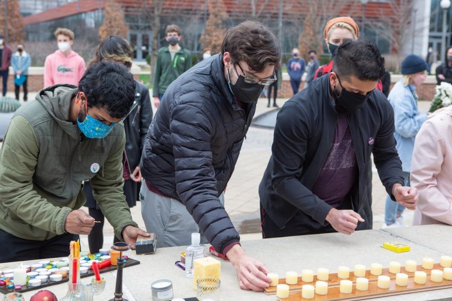 Students gather and light candles to commemorate the people whose lives were taken on Friday. Students of all different races gather to support each other.