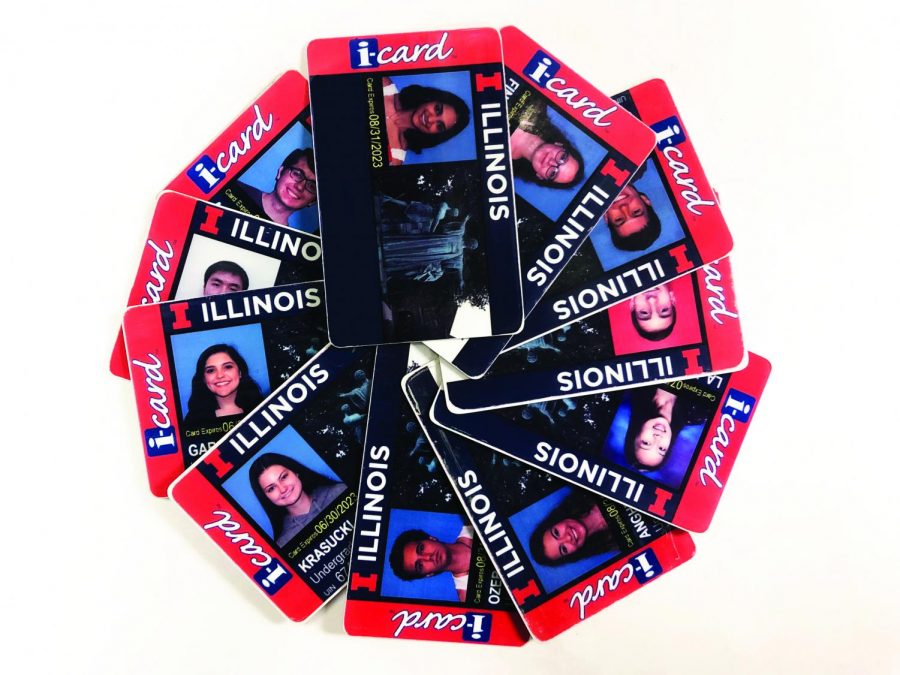 A pile of Illinois students’ iCards lays on a table. The University recently added the National Suicide Prevention Lifeline on the back of new iCards.