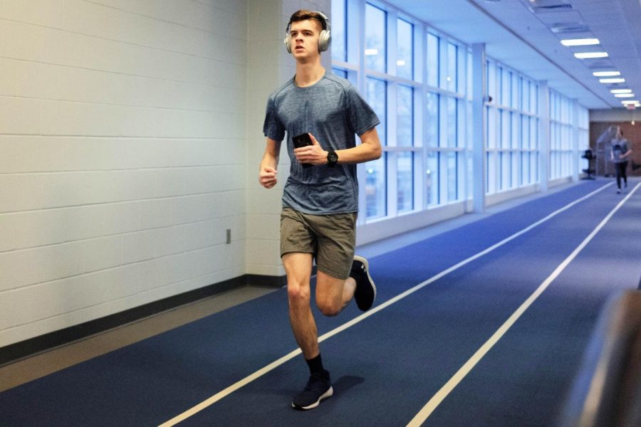 A student runs around the second level track at the Activities and Recreation Center on Feb. 29, 2020. The ARC has begun to lift major COVID_19 restrictions allowing more students to access the facility. 