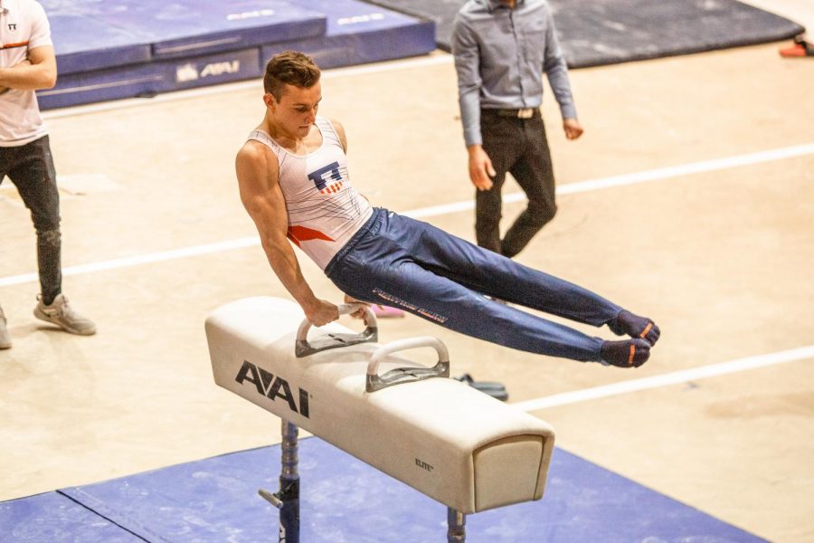 Michael Fletcher swings himself over the pommel horse at a meet against Ohio State on Jan. 23. Fletcher stepped up against Minnesota this weekend and received the Illini of the Week award for competing all-around seamlessly while most of the team’s top performers were injured.

