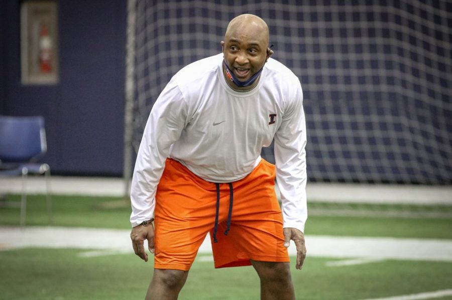 Assistant head Coach and wide receivers coach George McDonald prepares players at a lifting and conditioning practice for Illini football on Tuesday. Though McDonald may be a new coach, he brings hope for a better team in the future. 