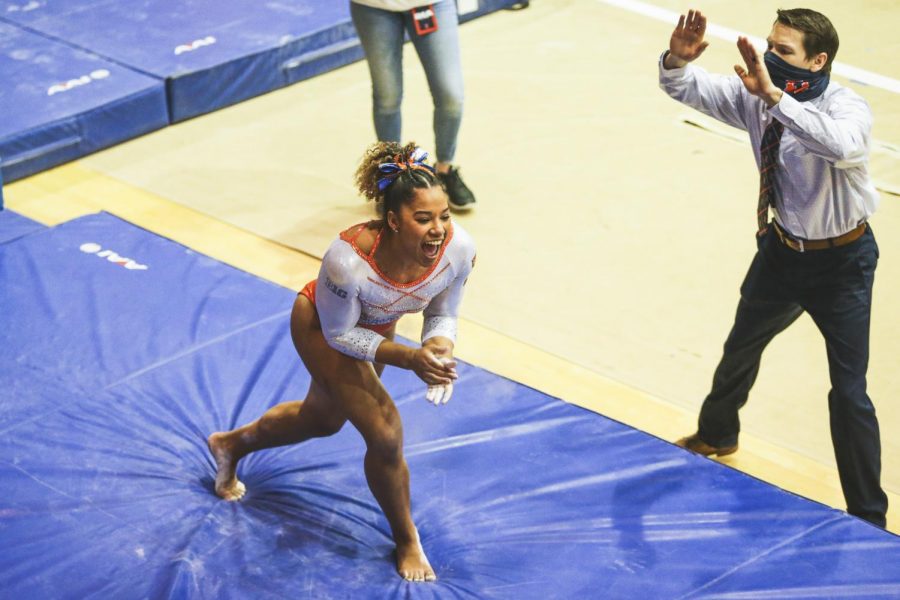 Mia Townes celebrates after coming off of the vault on Feb. 07 at Huff Hall. The Illinois women’s gymnastics team is hopeful that they can win their first Big Ten championship this season. 