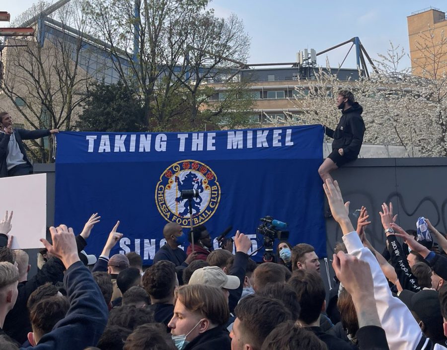 A crowd of soccer fans in Europe protest the Super League. Columnist Nick Johnson argues that the Super League was created in the interest of greed instead of the spirit of soccer.