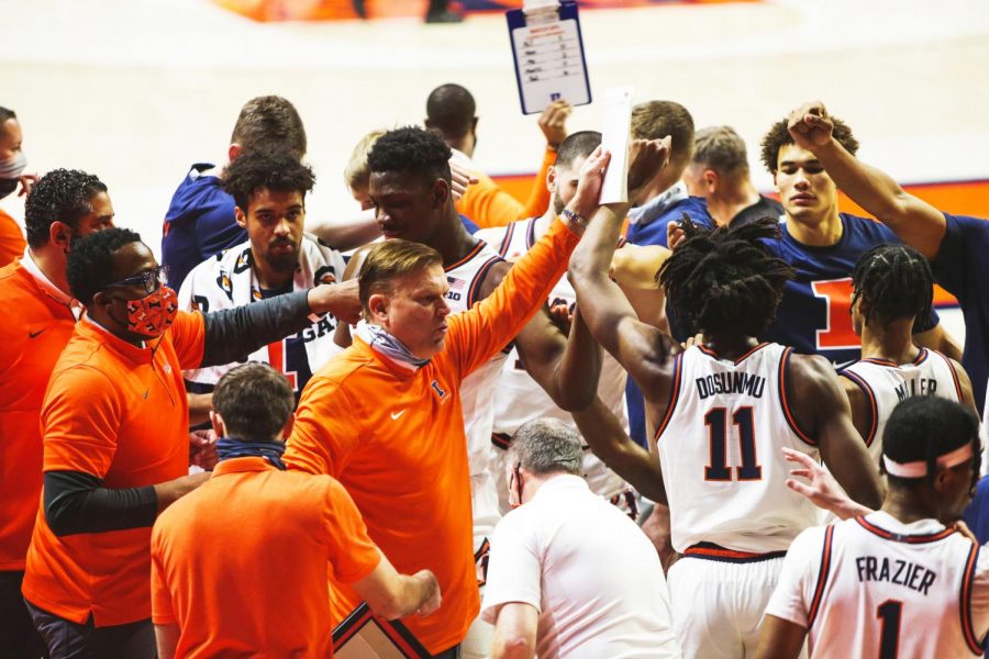 Illini basketball head coach Brad Underwood finishes a timeout huddle with his team during the game against Purdue Jan. 2. Underwood has been using his time in the offseason to recruit players from the transfer portal.
