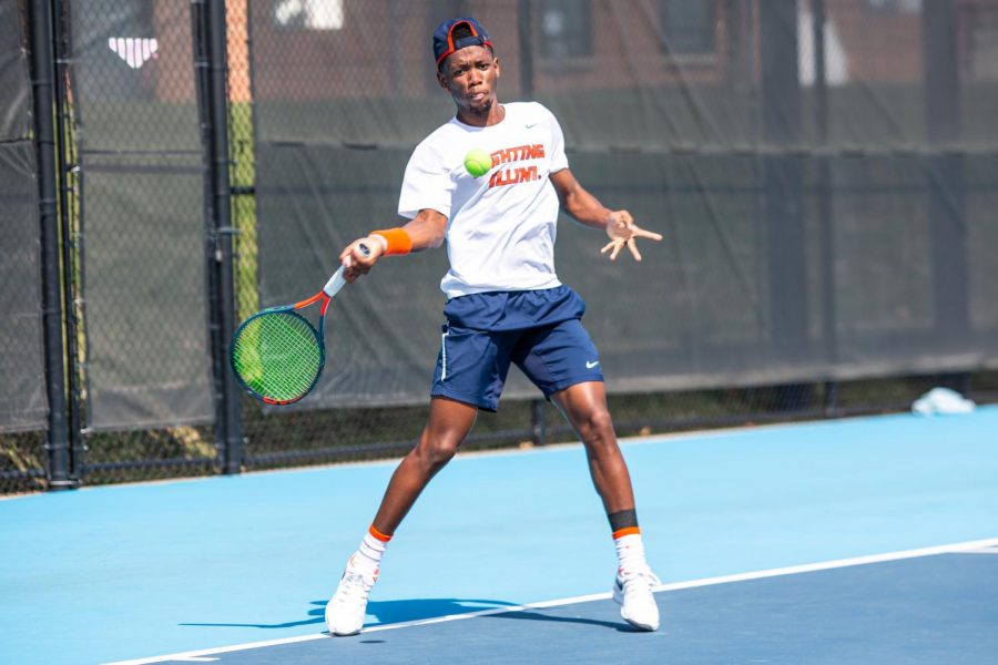 Redshirt+sophomore+Siphosothando+Montsi+returns+the+ball+in+his+singles+match+against+a+player+from+Minnesota+on+Sunday.+The+Illinois+mens+tennis+team+defeated+both+Wisconsin+and+Minnesota+this+weekend+at+Atkins+Tennis+Center.